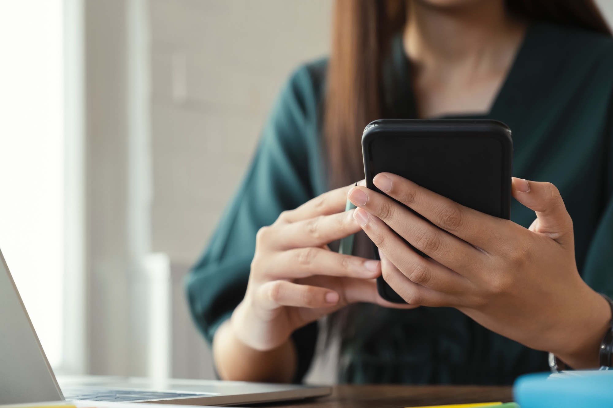 Close up of woman using mobile phone.